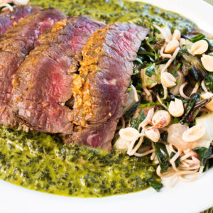 Sweet & Spicy Allstad Farm Skirt Steak w' Cilantro Mint Mojo & Roasted Peanuts over hearty greens stir fry