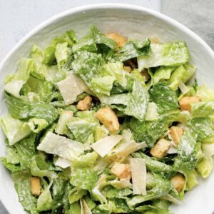 Caesar Salad w' Roasted Garlic Croutons & Shaved Parmesan Garnish